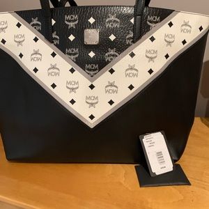 Mcm black leather bag . Used twice! My daughter moved and left it behind